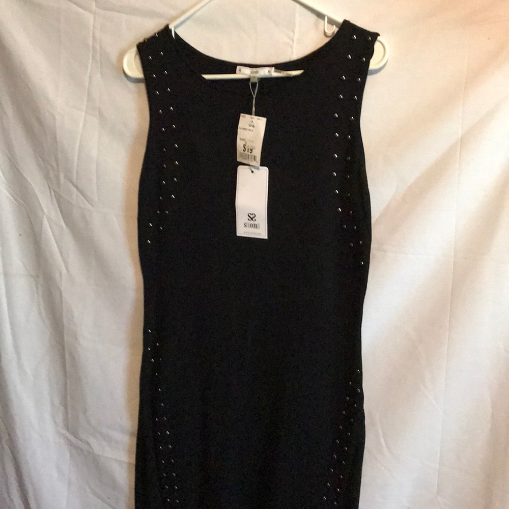 A black dress with beads down each side
